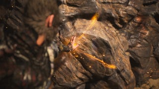 The player interacts with a large rock after placing the Buddha's Eyeballs in it in Black Myth Wukong