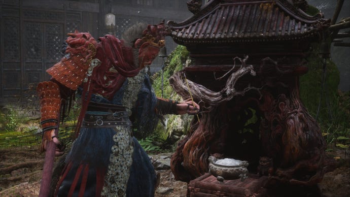 The player lights incense at a Keeper's Shrine in Black Myth Wukong