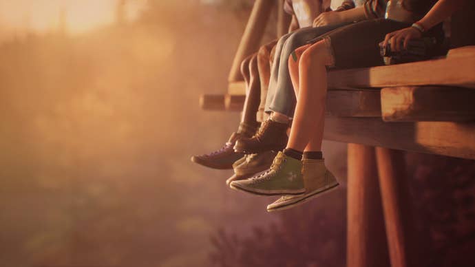 Four pairs of legs swing over the side of a bridge in a pearly summer sunset.